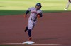 Houston Astros' Jose Altuve rounds third base after hitting a home run against the Oakland Athletics during the first inning of a baseball game in Oakland, Calif., Wednesday, May 19, 2021. (AP Photo/Jeff Chiu)