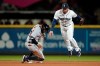 Seattle Mariners second baseman Jack Mayfield, right, avoids Detroit Tigers' Harold Castro, left, after a force at second on a double play hit into by Jonathan Schoop during the seventh inning of a baseball game Wednesday, May 19, 2021, in Seattle. (AP Photo/Ted S. Warren)