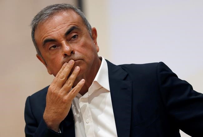 FILE - In this Sept. 29, 2020, file photo, former Nissan Motor Co. Chairman Carlos Ghosn holds a press conference at the Maronite Christian Holy Spirit University of Kaslik, as he launches an initiative to help Lebanon that is undergoing a severe economic and financial crisis, in Kaslik, north of Beirut, Lebanon. A Dutch court has ordered fugitive, former Nissan chairman Carlos Ghosn to repay nearly 5 million euros in salary to an Amsterdam-based alliance between Nissan and Mitsubishi, and rejected his claim for millions in compensation for wrongful dismissal. (AP Photo/Hussein Malla, File)