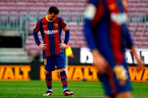 Barcelona's Lionel Messi reacts during the Spanish La Liga soccer match between FC Barcelona and Celta at the Camp Nou stadium in Barcelona, Spain, Sunday, May. 16, 2021. (AP Photo/Joan Monfort)