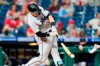 Miami Marlins' Chad Wallach hits a run-scoring ground out off Philadelphia Phillies pitcher Archie Bradley during the sixth inning of a baseball game, Thursday, May 20, 2021, in Philadelphia. (AP Photo/Matt Slocum)