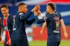 PSG's Neymar, right, celebrates with PSG's Kylian Mbappe after he scores his sides first goal during the French League One soccer match between Paris Saint-Germain and Reims at the Parc des Princes stadium in Paris, France, Sunday, May 16, 2021. (AP Photo/Michel Euler)