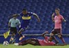 Sebastian Villa of Argentina's Boca Juniors, left, goes with the ball past Nixon Molina of Ecuador's Barcelona during a Copa Libertadores soccer match at the Bombonera stadium in Buenos Aires, Argentina, Thursday, May 20, 2021. (Marcelo Endelli/Pool via AP)
