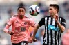 Sheffield United's Daniel Jebbison, left, and Newcastle's Federico Fernandez, right, challenge for the ball during the English Premier League soccer match between Newcastle United and Sheffield United at St. James' Park in Newcastle, England, Wednesday, May 19, 2021. THE CANADIAN PRESS/AP-Alex Pantling/Pool via AP