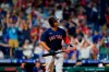 Boston Red Sox's Rafael Devers watches after hitting a two-run home run off Philadelphia Phillies pitcher Connor Brogdon during the seventh inning of an interleague baseball game, Friday, May 21, 2021, in Philadelphia. (AP Photo/Matt Slocum)