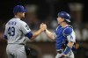 Los Angeles Dodgers pitcher Blake Treinen (49) and catcher Will Smith celebrate the team's 2-1 victory over the San Francisco Giants in a baseball game Friday, May 21, 2021, in San Francisco. (AP Photo/D. Ross Cameron)