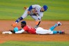 Miami Marlins' Jazz Chisholm Jr. is tagged out by New York Mets shortstop Francisco Lindor on an attempted steal of second during the first inning of a baseball game Friday, May 21, 2021, in Miami. (AP Photo/Lynne Sladky)
