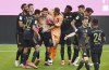 Bayern's Robert Lewandowski, fourth from left, celebrates with his teammates after scoring his side's fifth goal during the Bundesliga soccer match between Bayern Munich and FC Augsburg at the Allianz Arena stadium in Munich, Germany, Saturday, May 22, 2021. (Sven Hoppe, Pool via AP)