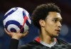 Liverpool's Trent Alexander-Arnold holds up the ball during the English Premier League soccer match between Burnley and Liverpool at Turf Moor in Burnley, England, Wednesday May 19, 2021. (Alex Livesey/Pool via AP)