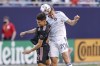Chicago Fire defender Wyatt Omsberg (20) heads the ball against Inter Miami forward Gonzalo Higuain (9) during the second half of an MLS soccer match, Saturday, May 22, 2021, in Chicago. (AP Photo/Kamil Krzaczynski)