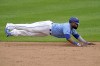 Kansas City Royals' Carlos Santana slides to second as he advances on a fly out hit by Salvador Perez during the fifth inning of a baseball game against the Detroit Tigers Saturday, May 22, 2021, in Kansas City, Mo. (AP Photo/Charlie Riedel)