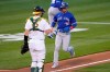 Toronto Blue Jays' Cavan Biggio (8) scores a run past Oakland Athletics catcher Sean Murphy (12) on a single by Teoscar Hernandez during the third inning against the Oakland Athletics in a baseball game in Oakland, Calif., on Monday, May 3, 2021. The Toronto Blue Jays put third baseman Cavan Biggio on the 10-day injured list with a cervical spine ligament sprain on Saturday. THE CANADIAN PRESS/AP, Tony Avelar