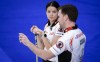 Team Einarson/Gushue third Brad Gushue, right, and skip Kerri Einarson discuss strategy during the Canadian Mixed Doubles Curling Championship final in Calgary, Alta., Thursday, March 25, 2021.THE CANADIAN PRESS/Jeff McIntosh