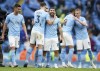 Manchester City's Sergio Aguero, centre, celebrates with teammates after scoring during the English Premier League soccer match between Manchester City and Everton at the Etihad stadium in Manchester, Sunday, May 23, 2021.(AP Photo/Dave Thompson, Pool)