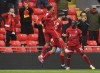 Liverpool's Sadio Mane, right, celebrates scoring his sides first goal during the English Premier League soccer match between Liverpool and Crystal Palace at Anfield stadium in Liverpool, England, Sunday, May 23, 2021. (Paul Ellis/Pool via AP)
