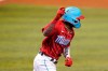 Miami Marlins' Jazz Chisholm Jr. reacts after hitting an RBI-single to score Garrett Cooper during the second inning of a baseball game against the New York Mets, Sunday, May 23, 2021, in Miami. (AP Photo/Lynne Sladky)
