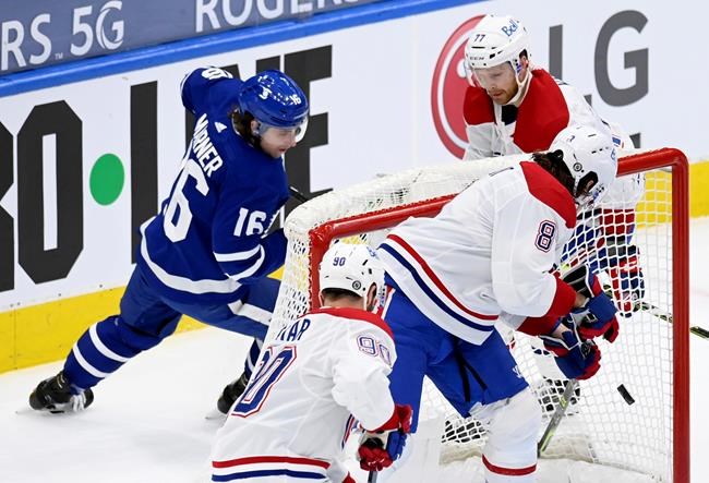 Toronto Maple Leafs centre Mitchell Marner (16) watches his goal bounce around inside the net as Montreal Canadiens defenceman Ben Chiarot (8) and teammates Tomas Tatar (90) and Brett Kulak (77) scramble during first period NHL hockey action in Toronto, Thursday, May 6, 2021. Kulak feels his team lost focus