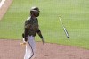 San Diego Padres' Fernando Tatis Jr. flips his bat after hitting a grand slam off Seattle Mariners relief pitcher Robert Dugger in the seventh inning of a baseball game Sunday, May 23, 2021, in San Diego. (AP Photo/Derrick Tuskan)