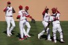 The Los Angeles Angels celebrate a 6-5win over the Oakland Athletics after their baseball game Sunday, May 23, 2021, in Anaheim, Calif. (AP Photo/Ashley Landis)