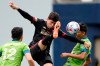 Atlanta United midfielder Matheus Rossetto, center leaps between Seattle Sounders' Fredy Montero (12) and Danny Leyva, right, during the second half of an MLS soccer match, Sunday, May 23, 2021, in Seattle. The match ended in a 1-1 tie. (AP Photo/Ted S. Warren)