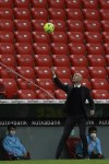 Real Madrid's head coach Zinedine Zidane tries to catch the ball during Spanish La Liga soccer match between Athletic Bilbao and Real Madrid at San Mames stadium, in Bilbao, northern Spain, Sunday, May 16, 2021. (AP Photo/Alvaro Barrientos)