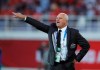 FILE - In this Jan. 15, 2019, file photo, Australia's head coach Graham Arnold, directs his players during the AFC Asian Cup group B soccer match between Australia and Syria at the Khalifa bin Zayed Stadium in Al Ain, United Arab Emirates.After 18 months without a game, the gathering of Australian players in Dubai ahead of next month's World Cup qualifiers feels like a family reunion for head coach Graham Arnold. (AP Photo/Hassan Ammar, File)