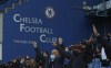 Fans support their team before the English Premier League soccer match between Chelsea and Leicester City at Stamford Bridge Stadium in London, Tuesday, May 18, 2021. (Catherine Ivill/Pool via AP)