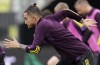 Manchester United's Alex Telles warms up during a training session in Gdansk, Poland, Tuesday May 25, 2021 ahead of the Europa League final soccer match between Manchester United and Villarreal. (AP Photo/Michael Sohn)