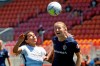 FILE - Portland Thorns FC midfielder Rocky Rodriguez, left, and North Carolina Courage midfielder Samantha Mewis, right, battle for the ball during the second half of an NWSL Challenge Cup soccer match at Zions Bank Stadiumin Herriman, Utah, in this Saturday, June 27, 2020, file photo. Samantha Mewis is back home in the National Women's Soccer League after a stint overseas with Manchester City. On Monday, May 24, 2021, she returned to practice with the North Carolina Courage after officially re-signing with the club. (AP Photo/Rick Bowmer, File)