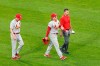 St. Louis Cardinals' Harrison Bader, center, leaves the game with manager Mike Shildt, left, and a member of the training staff after Bader was unable to make a diving catch of a shallow fly ball by Chicago White Sox's Nick Madrigal during the third inning of an interleague baseball game Monday, May 24, 2021, in Chicago. (AP Photo/Charles Rex Arbogast)