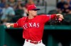 Texas Rangers starting pitcher Kyle Gibson throws to a Houston Astros batter during the first inning of a baseball game in Arlington, Texas, Friday, May 21, 2021. (AP Photo/Tony Gutierrez)
