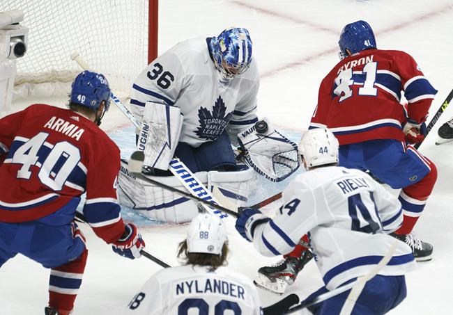 Toronto Maple Leafs goaltender Jack Campbell stops Montreal Canadiens' Paul Byron during second-period NHL Stanley Cup playoff action in Montreal, Tuesday, May 25, 2021. THE CANADIAN PRESS/Paul Chiasson