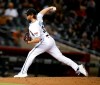 Arizona Diamondbacks' Kevin Ginkel throws to a San Francisco Giants batter during the eighth inning of a baseball game Tuesday, May 25, 2021, in Phoenix. (AP Photo/Darryl Webb)