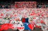 FILE - Liverpool soccer fans arrive at Anfield Stadium to pay their respects as flower tributes cover the 'Kop' end of the field, in Liverpool, on April 17, 1989, following April 15, when fans surged forward during the FA Cup semi-final between Liverpool and Nottingham Forest at Hillsborough Stadium in Sheffield, when the crash barriers gave way, killing 96 Liverpool fans and injuring over 200 others. A British judge has brought an end to a trial of two former police officers and an ex-lawyer on charges of perverting the course of justice in connection with the 1989 Hillsborough soccer disaster that saw 96 Liverpool fans die. Judge William Davis told jurors Wednesday, May 26, 2021 at a court in Salford, northwest England, that there was no case they could properly consider for the defendants. Donald Denton, an 83-year-old retired chief superintendent at West Yorkshire Police, former detective chief inspector Alan Foster, 74, and former solicitor Peter Metcalf, 71, had been charged of amending police statements following the disaster in an attempt to minimize blame on the force.( AP Photo, File)