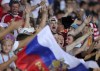 FILE - In this Friday, Oct. 11, 2019 filer, Russian fans cheer prior to the Euro 2020 group I qualifying soccer match between Cyprus and Russia at GSP stadium in Nicosia, Cyprus. With games scattered across 11 cities from London to Baku, this year's European Championship is going to be hard on the fans. Amid the coronavirus pandemic, it remains to be seen how many supporters will be able to attend matches or if any can follow their teams across borders into different countries. (AP Photo/Petros Karadjias, File)