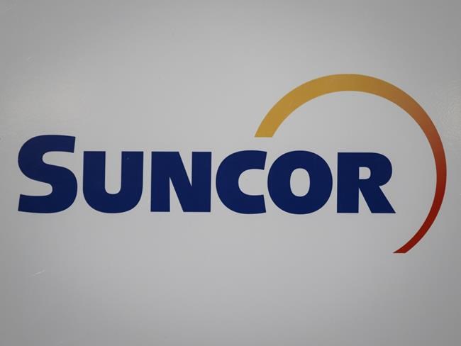 A Suncor logo is shown at the company's annual meeting in Calgary, Thursday, May 2, 2019. THE CANADIAN PRESS/Jeff McIntosh