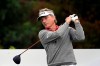FILE - Bernhard Langer, of Germany, warms up before his tee shot on the first hole during the final round of the PNC Championship golf tournament in Orlando, Fla., in this Sunday, Dec. 20, 2020, file photo. The 2021 Senior PGA Championship at Southern Hills Country Club begins Thursday. Bernhard Langer holds a slight lead over Ernie Els at the top of the money list. Kevin Sutherland has the highest all-around ranking and is third on the money list. (AP Photo/Phelan M. Ebenhack, File)