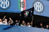 Inter Milan's head coach Antonio Conte, right, celebrates with the team after clinching the Serie A title, at the end of the Serie A soccer match between Inter Milan and Udinese, at the San Siro stadium in Milan, Italy, Sunday, May 23, 2021. (AP Photo/Nicola Marfisi)