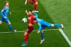 Cologne's Salih Ozcan, center, in a header duel with Kiel's Niklas Hauptmann during the Bundesliga relegation soccer match between FC Cologne and Holstein Kiel at the Rhein-Energie-Stadion in Cologne, Germany, Wednesday, May 25, 2021. (Rolf Vennenbernd/Pool photo via AP)