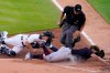 Cleveland Indians' Josh Naylor is tagged out at home by Detroit Tigers catcher Jake Rogers as home plate umpire Lance Barrett watches during the second inning of a baseball game, Wednesday, May 26, 2021, in Detroit. Naylor was trying to score from first base on teammate Owen Miller's double to deep center. (AP Photo/Carlos Osorio)