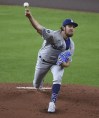 Los Angeles Dodgers starting pitcher Trevor Bauer delivers during the first inning of a baseball game against the Houston Astros, Wednesday, May 26, 2021, in Houston. (AP Photo/Eric Christian Smith)