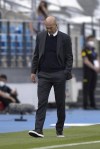 Real Madrid's head coach Zinedine Zidane walks by the touchline during the Spanish La Liga last round soccer match between Real Madrid and Villarreal at the Alfredo Di Stefano stadium in Madrid, Saturday, May 22, 2021. (AP Photo/Pablo Morano)