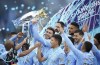 Manchester City players celebrate winning the English Premier League title after the soccer match between Manchester City and Everton at the Etihad stadium in Manchester, Sunday, May 23, 2021.(AP Photo/Dave Thompson, Pool)