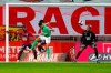 Saint-Etienne's Timothee Kolodziejczak centre, challengers for the ball as Lille's goalkeeper Mike Maignan right, looks on during the French League One soccer match between Lille and Saint-Etienne in Lille, France, Sunday, May 16, 2021. (AP Photo/Michel Springler)