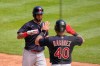 Cleveland Indians' Eddie Rosario, left, is greeted at home plate by Harold Ramirez after hitting a two-run home run during the sixth inning of a baseball game against the Detroit Tigers, Thursday, May 27, 2021, in Detroit. (AP Photo/Carlos Osorio)