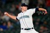 Seattle Mariners starting pitcher Chris Flexen throws to a Texas Rangers batter during the first inning of a baseball game Thursday, May 27, 2021, in Seattle. (AP Photo/Elaine Thompson)