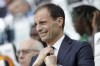FILE - In this April 20, 2019 file photo, then Juventus coach Massimiliano Allegri adjusts his tie prior to the start of a Serie A soccer match between Juventus and AC Fiorentina, at the Allianz stadium in Turin, Italy. Allegri returned to Juventus as coach on Friday, May 28, 2021 — only two seasons after he was fired by the Bianconeri. (AP Photo/Luca Bruno, file)