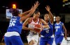 Canada's Miranda Ayim (9) drives between Cuba's Anisleidy Galindo (56) and Nahomis Vargas (12) during second half action of FIBA Women's Olympic Pre Qualifying Tournaments Americas 2019, in Edmonton, Alta., on Thursday, November 14, 2019.THE CANADIAN PRESS/Jason Franson