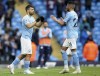 Manchester City's Sergio Aguero, left, is substituted for Manchester City's Riyad Mahrez during the English Premier League soccer match between Manchester City and Everton at the Etihad stadium in Manchester, Sunday, May 23, 2021.(AP Photo/Dave Thompson, Pool)