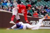 Cincinnati Reds' Jonathan India catches Chicago Cubs' Kris Bryant trying to steal second off a throw from catcher Tucker Barnhart during the sixth inning of a baseball game Friday, May 28, 2021, in Chicago. (AP Photo/Charles Rex Arbogast)